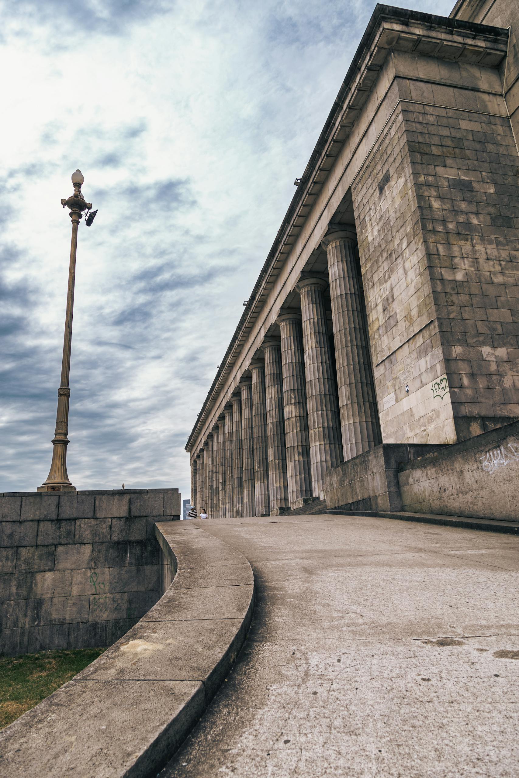 Grand facade of the University of Buenos Aires Faculty of Law on a cloudy day.