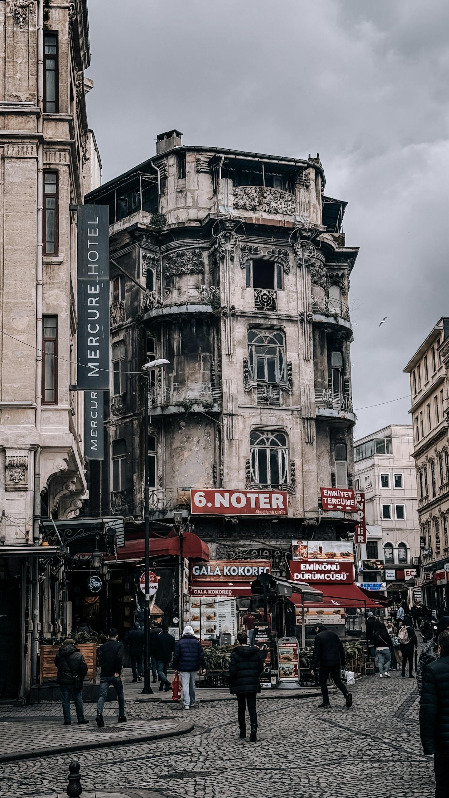 Busy street scene with historic architecture in urban setting.